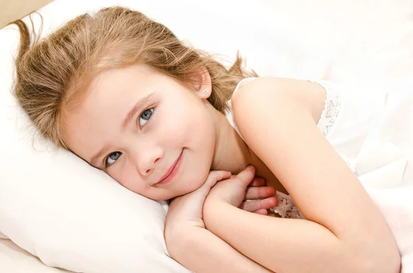 Adorable smiling little girl waked up — Stock Photo, Image