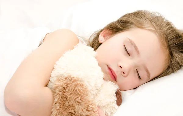 Adorabile bambina che dorme con giocattolo — Foto Stock