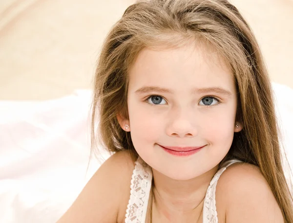 Adorable smiling little girl waked up — Stock Photo, Image