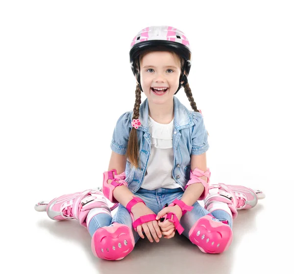 Linda niña sonriente en patines rosados —  Fotos de Stock