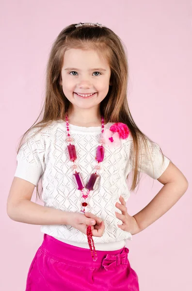 Adorable happy little girl posing with bag — Stock Photo, Image