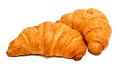 Two fresh perfect croissants isolated