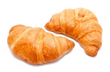 Two fresh perfect croissants isolated