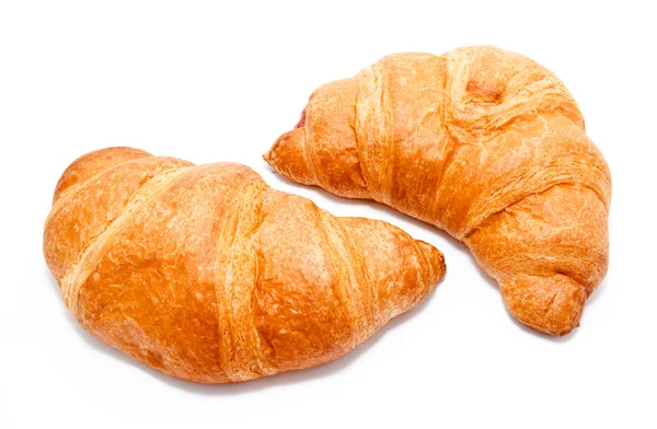 Two fresh perfect croissants isolated — Zdjęcie stockowe