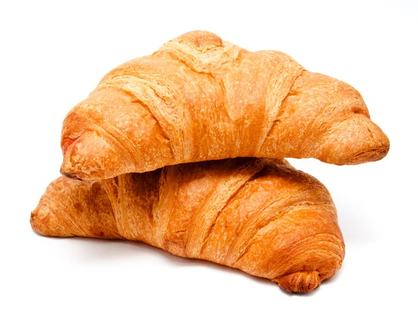 Two fresh perfect croissants isolated — Stok fotoğraf