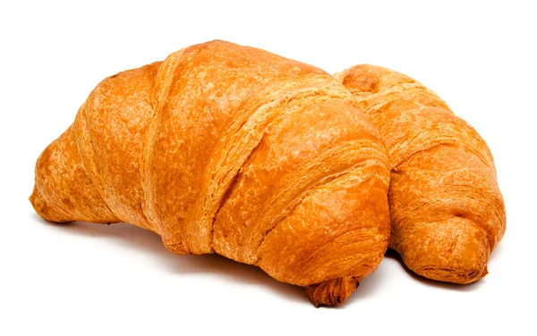 Two fresh perfect croissants isolated — Zdjęcie stockowe