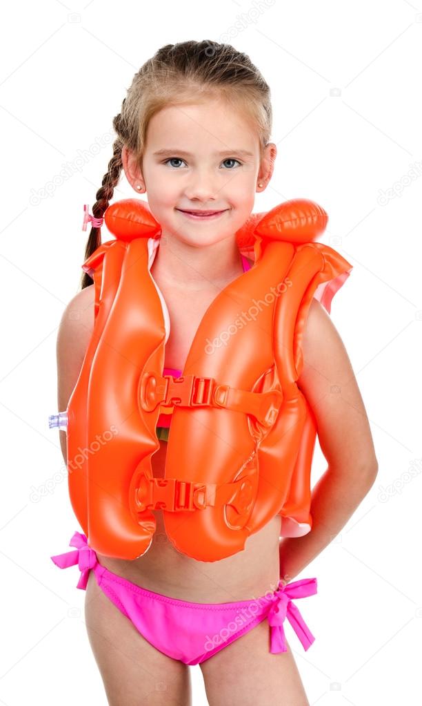 Cute happy little girl in life jacket