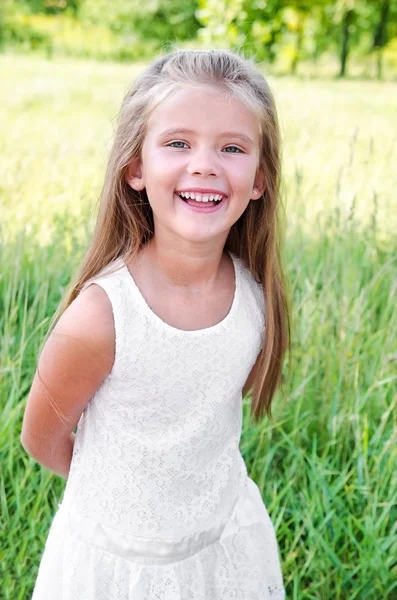 Portrait of smiling cute little girl in summer day — Stock Photo, Image