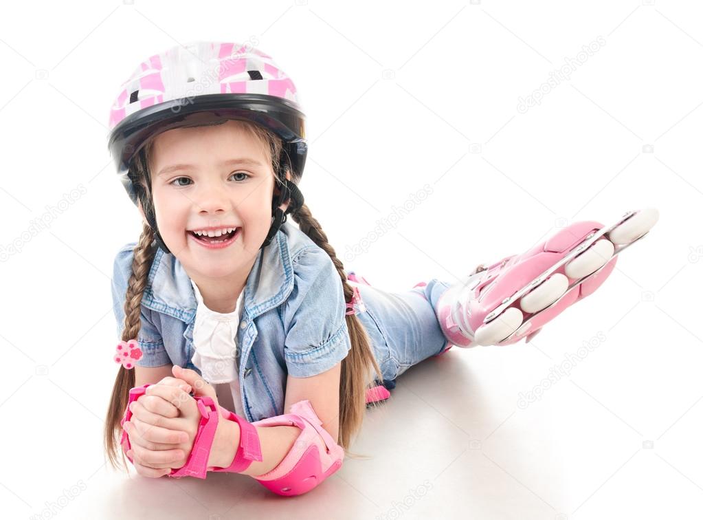 Cute smiling little girl in pink roller skates