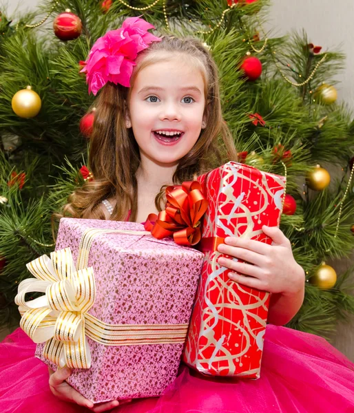 Happy adorable little girl with gift box — Stock Photo, Image