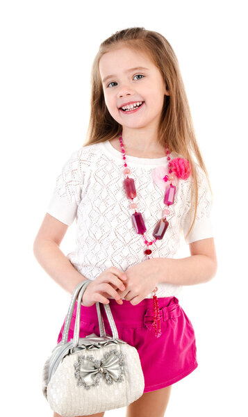 Happy cute little girl in skirt with bag and beads