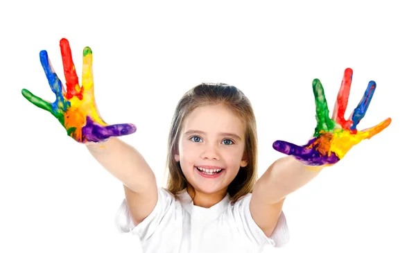 Glad söt liten flicka med färgglada målade händer Stockfoto