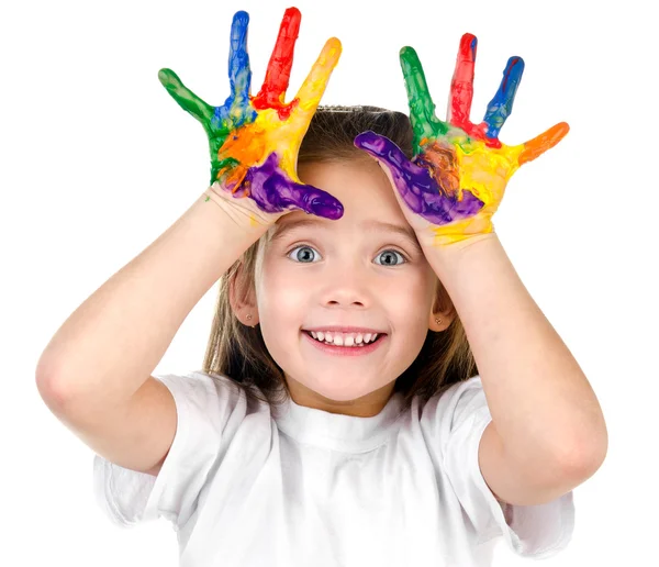Fröhliches süßes kleines Mädchen mit bunt bemalten Händen — Stockfoto