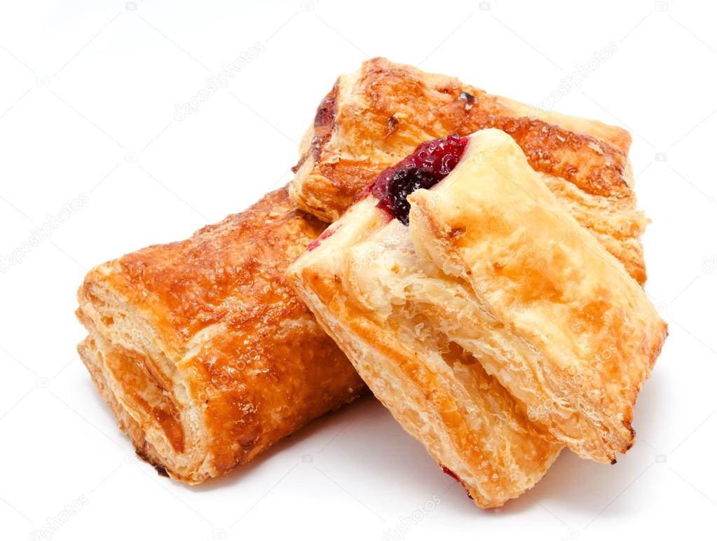 Fresh puff pastries with cherry jam isolated