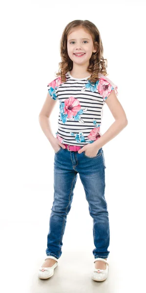 Cute smiling little girl in jeans isolated — Stock Photo, Image