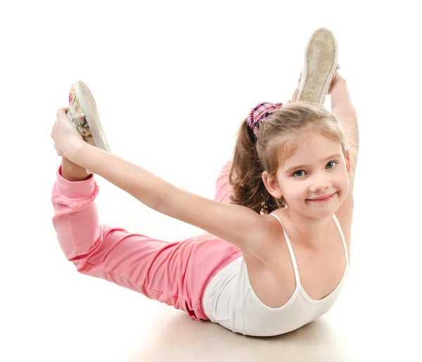 Cute little girl doing gymnastic exercise — Stock Photo, Image