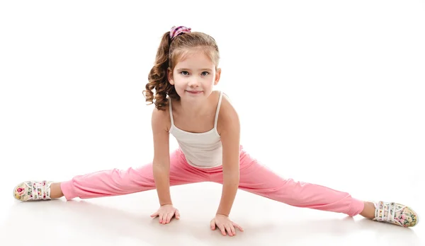 Cute little girl doing gymnastic exercise — Stock Photo, Image