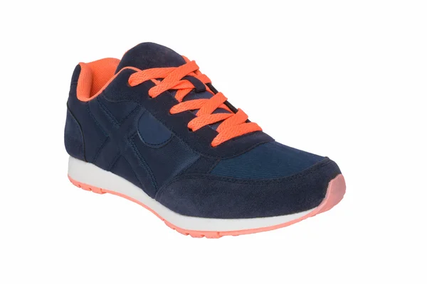 Mörk blå sneakers med orange skosnören — Stockfoto