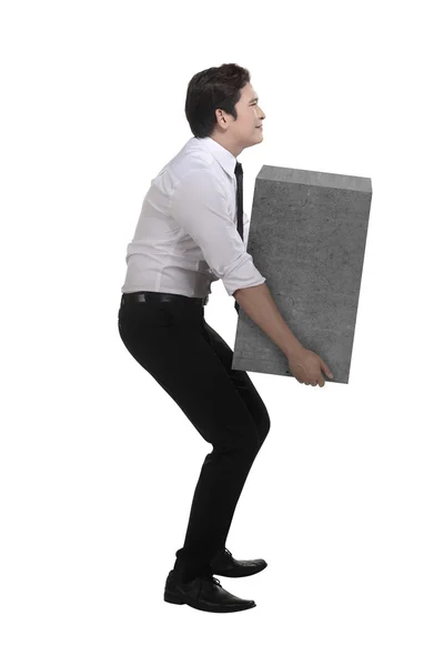 Asiatiska affärsman lift tung låda — Stockfoto