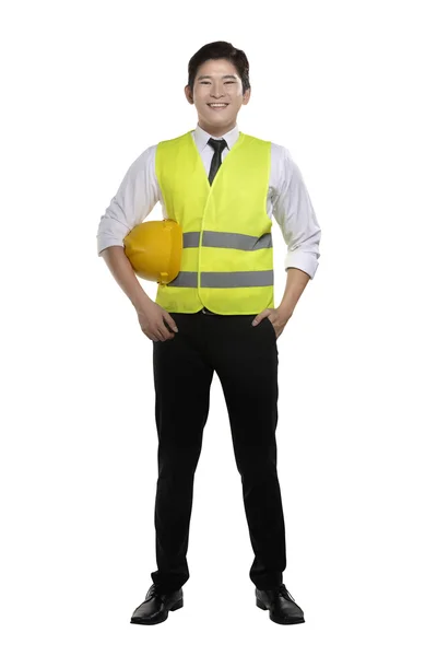 Εργαζόμενος φορώντας γιλέκο ασφαλείας και το κράνος — Φωτογραφία Αρχείου