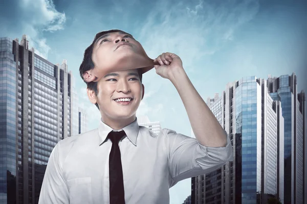Businessman remove his face mask — Stock Photo, Image