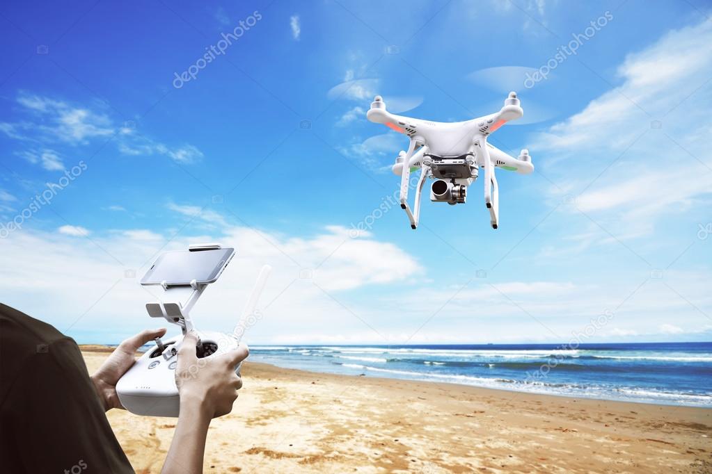 Male pilot controlling drone