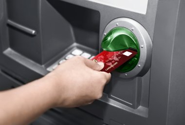 Human hand insert ATM card clipart