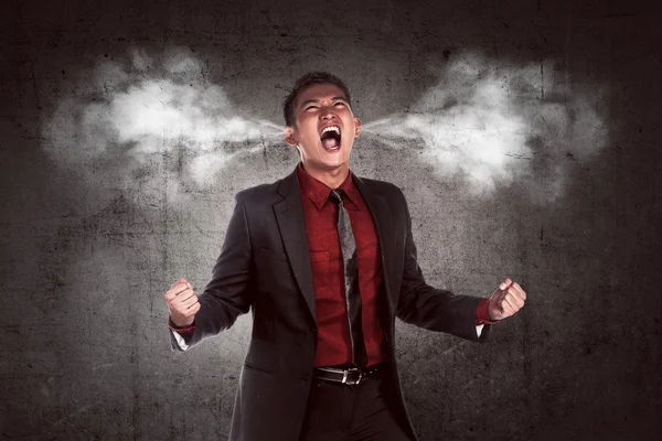 Young asian businessman in anger — Stock Photo, Image