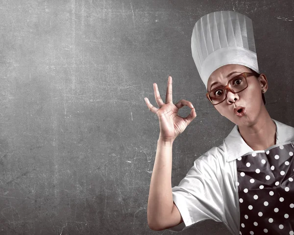 Young woman chef with ok sign gesture — Stock Photo, Image