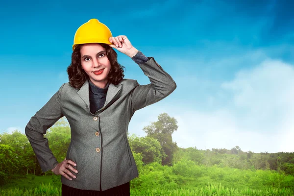 Asian woman holding hard hat — Stock Photo, Image