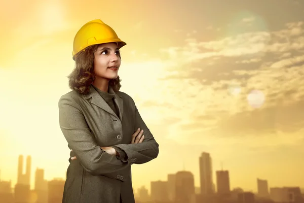 Asian businesswoman wearing yellow helmet — Stock Photo, Image