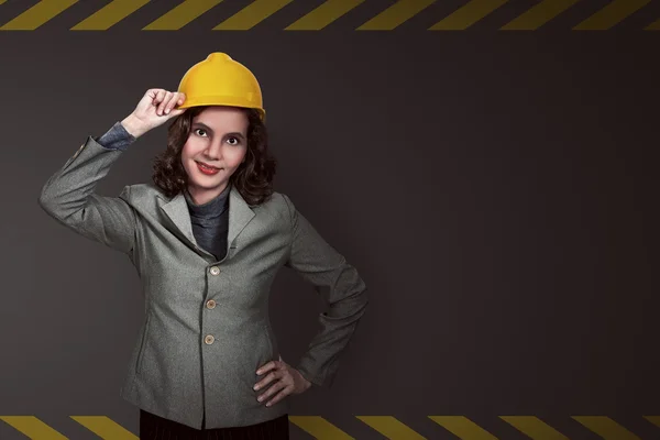 Asian businesswoman wearing yellow helmet — Stock Photo, Image