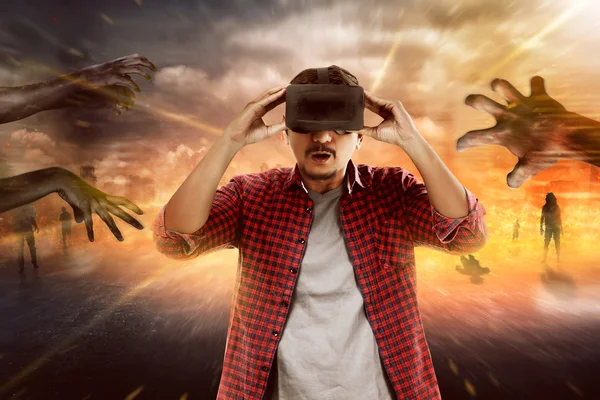 Young asian man wearing VR headset — Stock Photo, Image