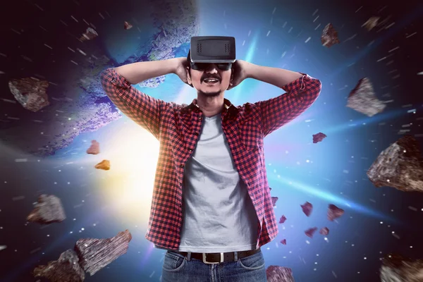 Young asian man wearing VR headset — Stock Photo, Image