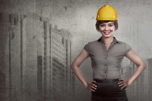 Asian business woman wearing hardhat — Stock Photo, Image