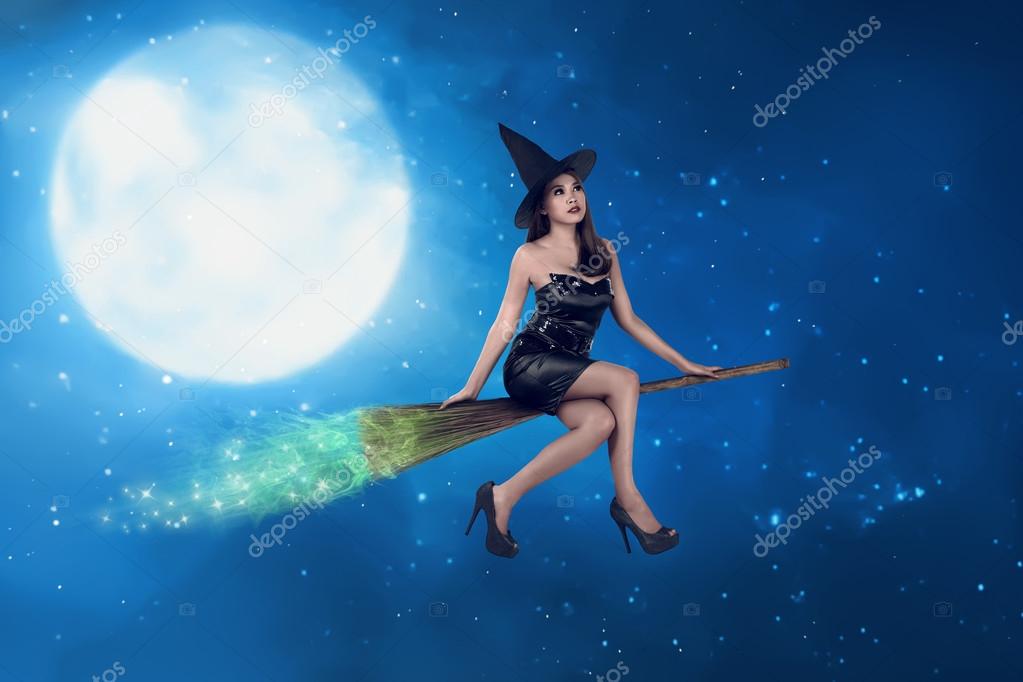 Witch woman riding the broom on the sky — Stock Photo © leolintang