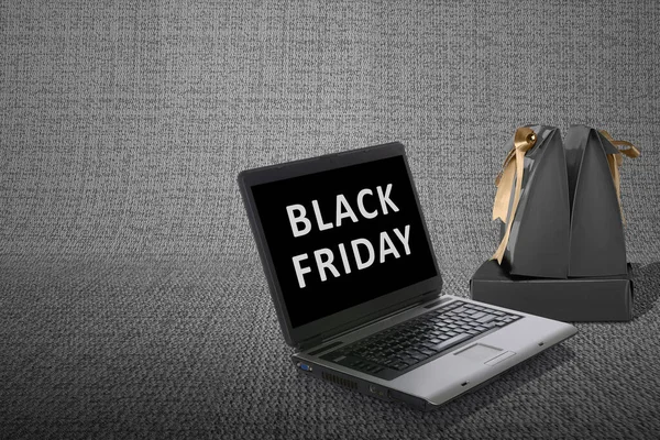 Black Paper Bag Gold Ribbon Laptop Black Friday Promotion Black — Stock Photo, Image