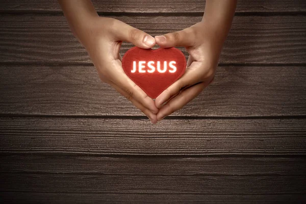 Menselijke Handen Met Rood Hart Met Jezus Tekst Met Houten — Stockfoto