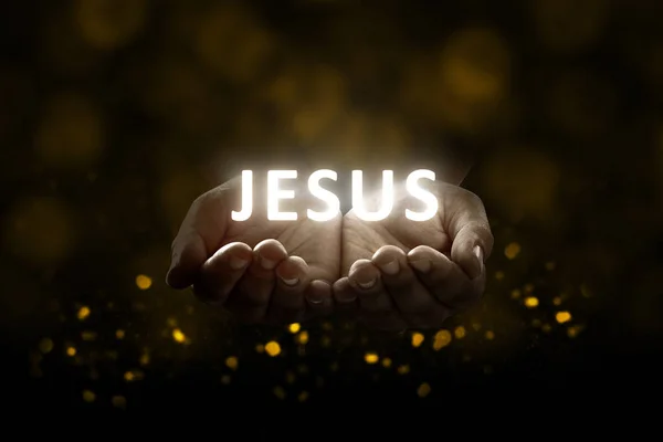 Людські Руки Моляться Богу Блискучим Текстом Ісуса Чорному Тлі — стокове фото