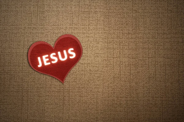 Red heart with Jesus text with textured background