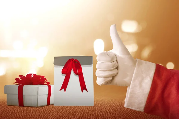 산타클로스는 엄지손가락에 상자를 몸짓을 크리스마스 — 스톡 사진