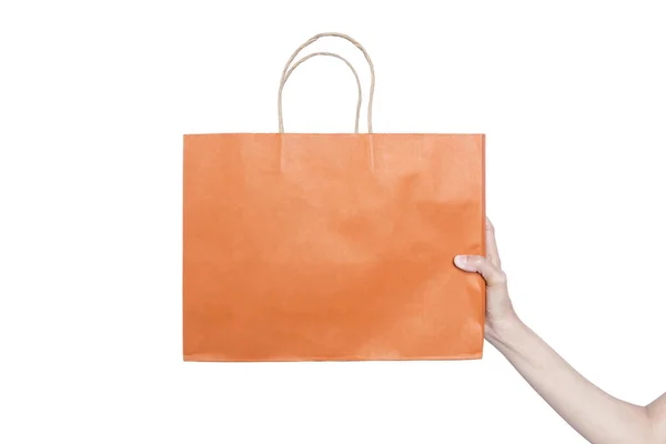 白い背景に隔離されたカラーショッピングバッグを持つ手 — ストック写真