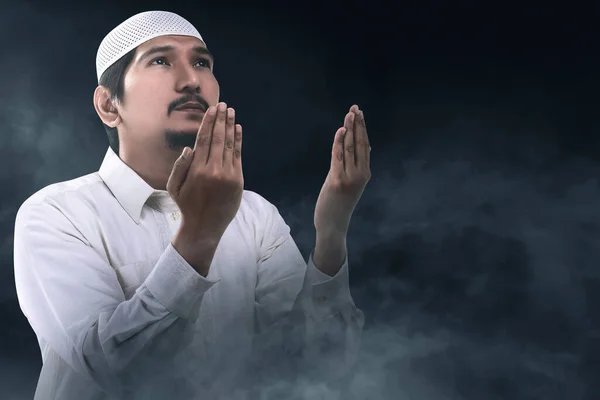 Asian Muslim Man Standing While Raised Hands Praying Dark Background — Stock fotografie