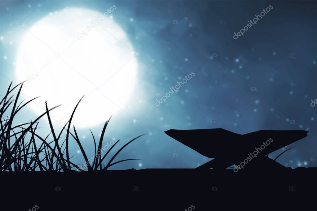 Silhouette of Quran open on a wooden placemat with the night scene background