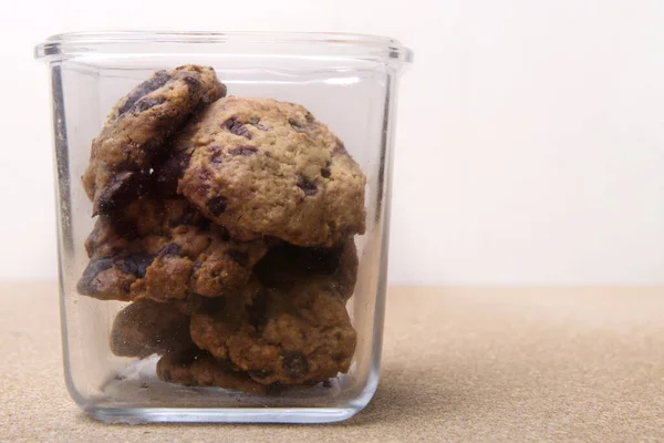 Stack of chocolate cookies in the jar