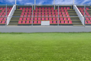 Stadyumdaki mavi arka planlı tribün koltuğu