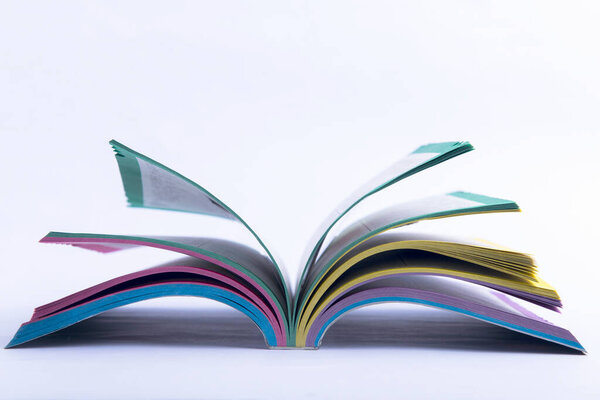 Opened the book on white background