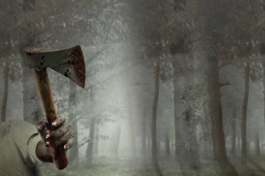 Perili bir ormanda baltayı tutan yaralı zombi elleri