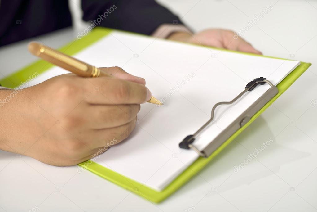 Man Writing On Blank Paper