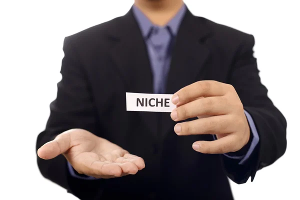 Man Holding Paper With Niche Text — Stock Photo, Image